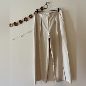 Beige slacks, worn but in good condition. Wide leg, super comfortable.